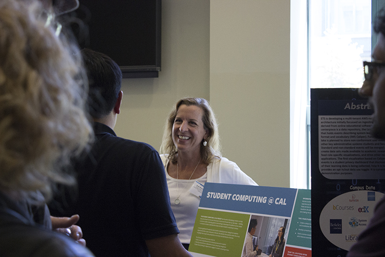 Associate CIO Anne Marie Richard smiles and talks with a roomful of students.