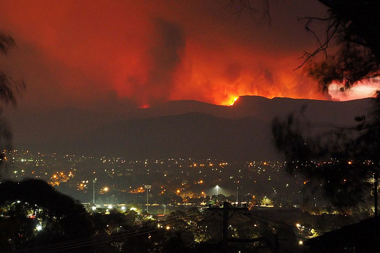 Wildlfires illuminate the night in the hills of southeastern Australia