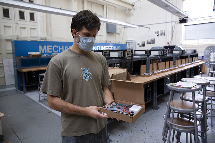 Electronic kits in small cardboard boxes are being assembled at the College of Engineering for students who have to do their mechanical engineering lab work at home this semester.