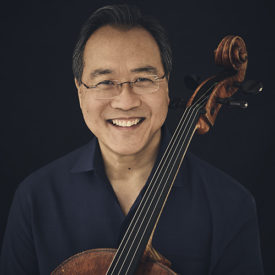 Yo-Yo Ma smiles while posing with his cello