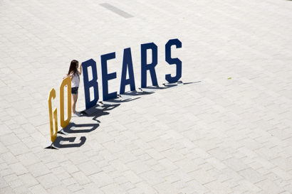 Giant blue and gold lettering spelling out Go Bears sits on a campus plaza, awaiting the start of Golden Bear Orientation in 2019.