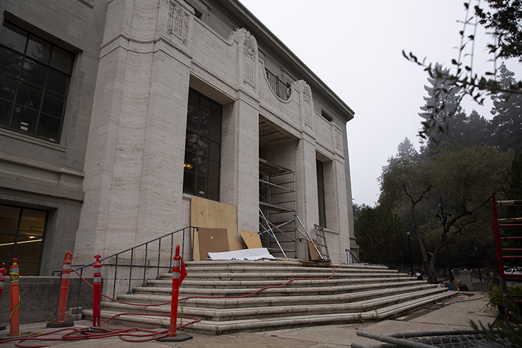 The exterior of Giannini Hall shows scaffolding and other signs of construction and seismic work.