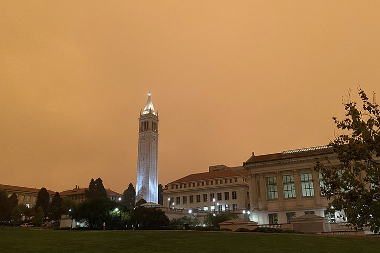 At 10:20 a.m., a photo of the Campanile and Memorial Glade shows outdoor lights shining as if it were night.