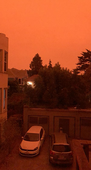 A very orange sky is in the background of this photo shot from a student's apartment building near campus.