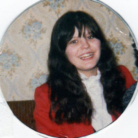 a portrait of Laila's mother smiling