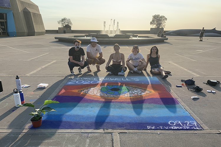 a colorful chalk illustration outside of the Berkeley science lab building depicting the eye on the cover of George Orwell's dystopian novel 