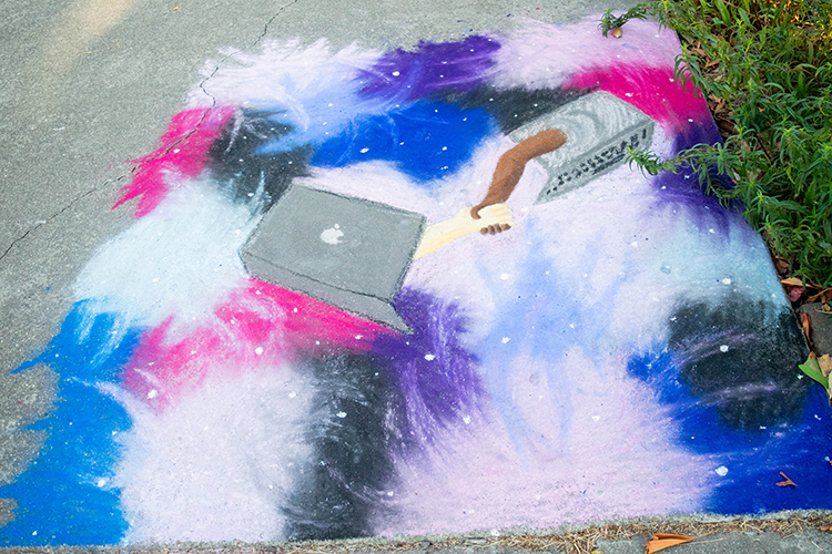 chalk drawing of a Mac laptop in the middle of a sea of colorful clouds