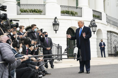 President Trump talks to reporters outside of the white house