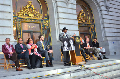 willie brown speaks in front of city hall