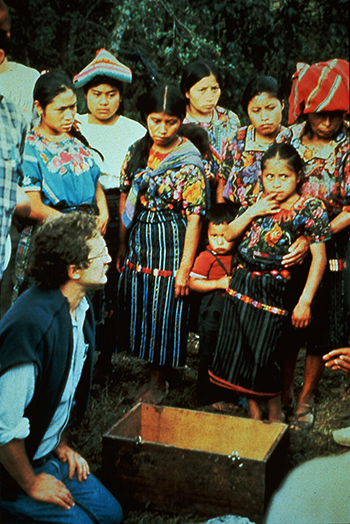 In Guatemala, Eric Stover, currently the faculty director at the Human Rights Center, kneels next to a box of human remains and asks family members for permission to remove the remains to take them to a hospital to be examined.