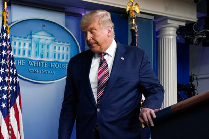 President Donald Trump steps down from the podium after a press conference at the White House