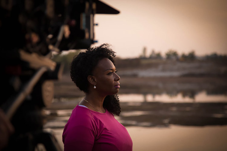 Reporter DeNeen Brown, who is African American, helps tell the story of the Tulsa Race Massacre and its lasting effects in the documentary "The Fire and the Forgotten," which is bring produced, in part by Eric Stover from UC Berkeley's Human Rights Center. In this photo, DeNeen looks out over the horizon.