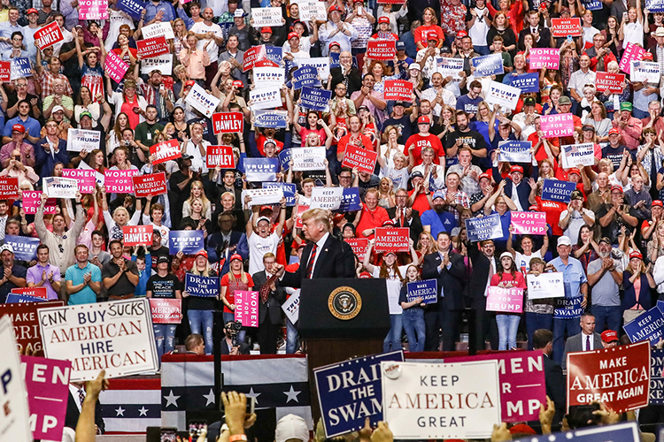 Donald Trump in a sea of cheering, sign-waving loyalists