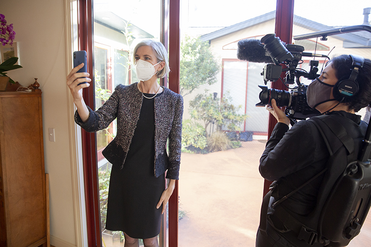 Doudna holding her cellphone while being video recorded