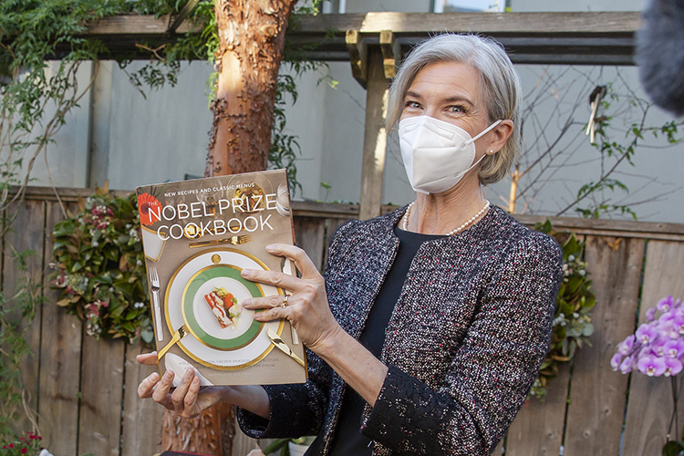 Doudna holding the Nobel Prize Cookbook