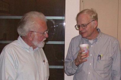 William Clemens and Walter Alvarez talking at a party