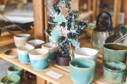 handmade mugs and ornaments on display