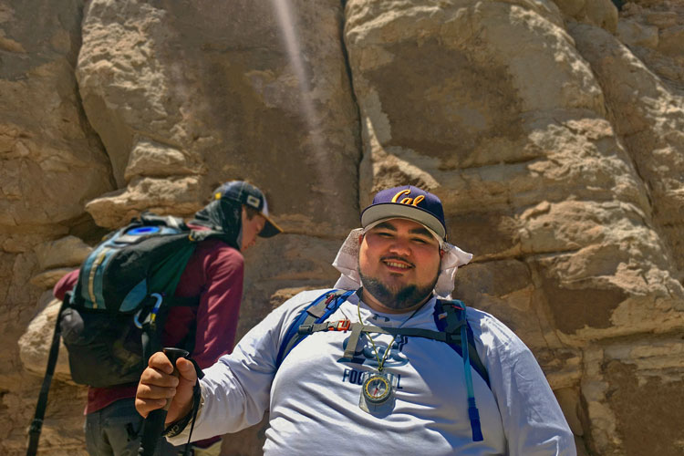 Morino Baca, a Native American graduate student in public health, works on an archaeology project in Pueblo de Abiquiú, 20 miles from Española in New Mexico where he grew up. At left, UC Berkeley student Jasper Sundeen. (Photo by Danny Sosa Aguilar)