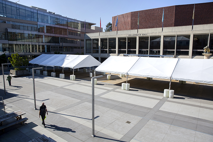 Large white canvas tents on Lower Sproul plaza are being used this semester for supplemental outdoor instruction for groups of 12 students, or less, and an instructor.