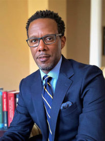 David C. Wilson, dean of the Goldman School of Public Policy, in a jacket and tie, smiling