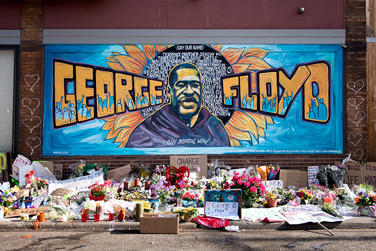 a brightly colored mural of George Floyd near the Minneapolis location where he was killed in May 2020