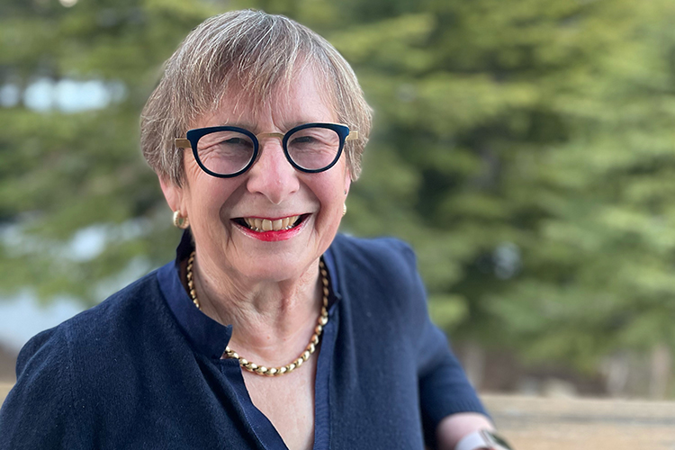 Catherine Koshland, vice chancellor for undergraduate education and the new interim executive vice chancellor and provost, smiles at the camera in this close-up portrait, wearing dark-framed eyeglasses and a big smile.