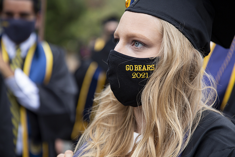 Like many graduates, Megan Wiener wore a Cal mask with her graduation garb. Hers is dark blue with the Cal logo on it.