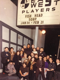 group of people pose outside of a theater, East West Players