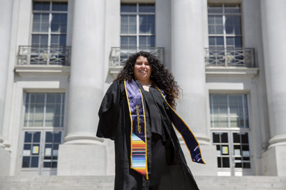 aurora smiles while she stands on steps on the UC Berkeley campus