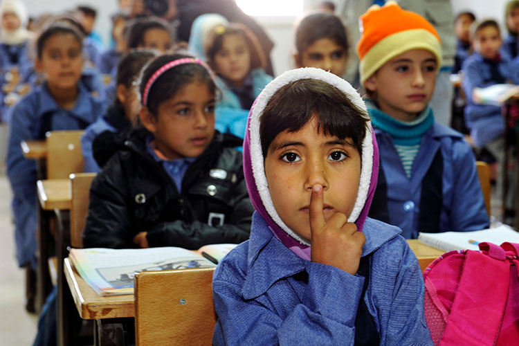 Refugee children in a classroom.