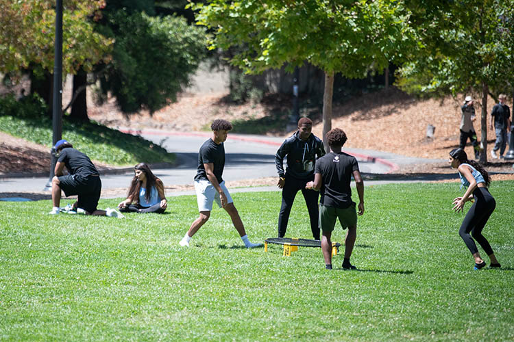 students play spike ball on memorial glade