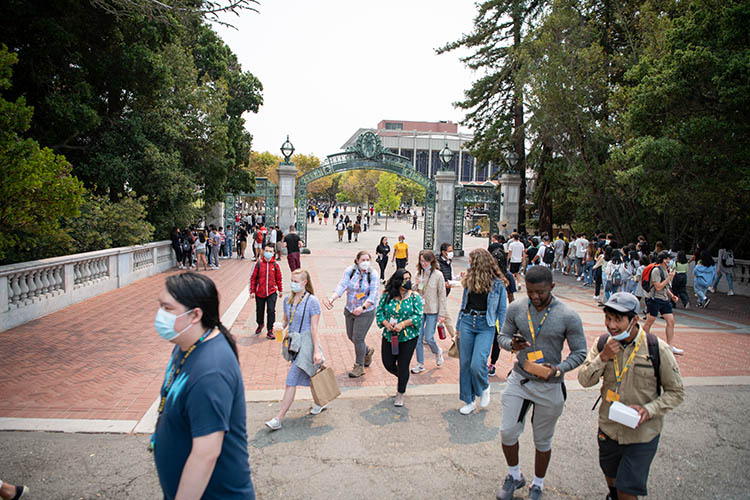 students walk near sather gate