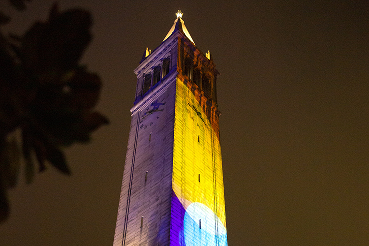 The Campanile is lit up in rainbow-colored lights during Golden Bear Orientation's Paint the Night event. (