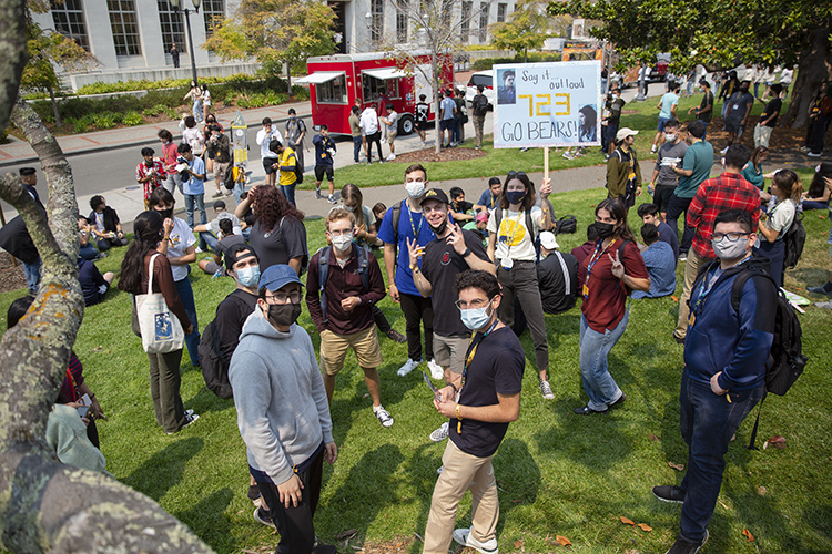 GBO attendees pose on campus, wearing masks, and a food truck is parked nearby.