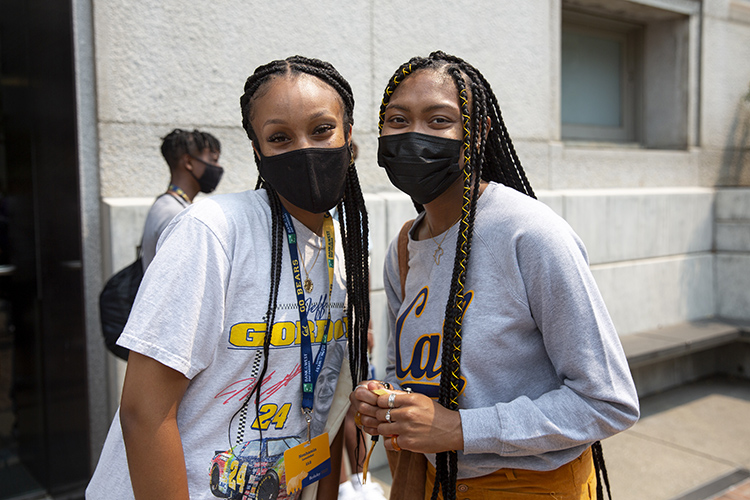 Two friends at GBO pose for a photo in their masks and Cal gear.