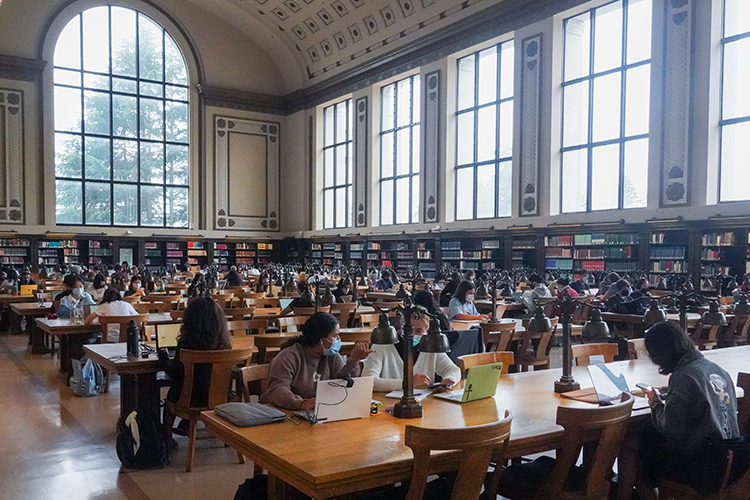 the North Reading Room in Doe library is filled with masked students