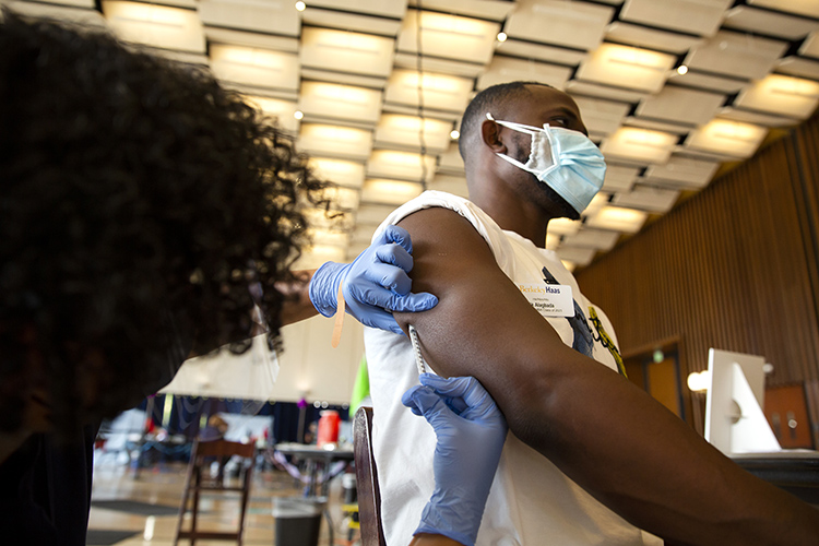 A graduate student receives a chicken pox vaccine at a vaccine clinic held in Pauley Ballroom the week before fall 2021 classes start.