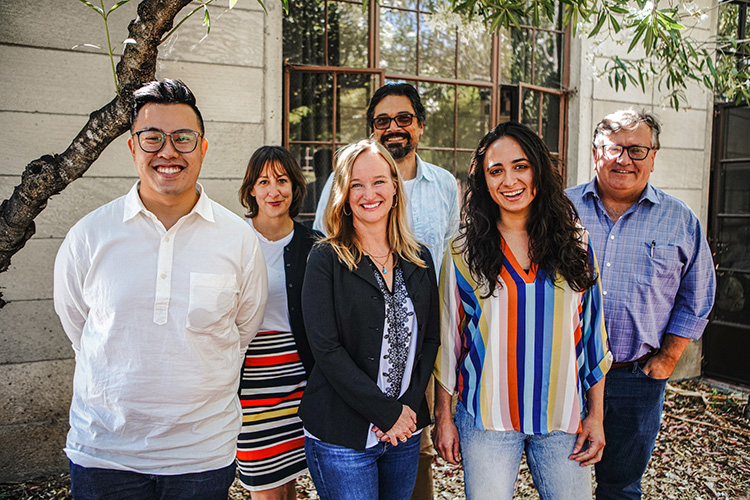 Berkeley Journalism students and faculty smiling.