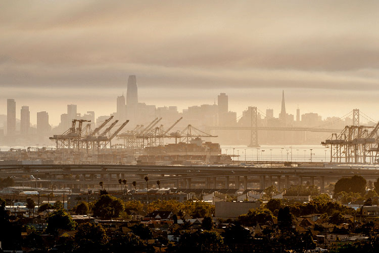 A photo of the San Francisco skyline with smoke in the air