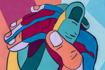 colorful drawing of two holding hands