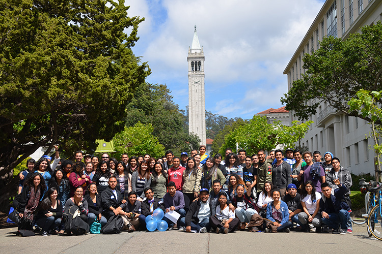 A group posing at a conference on campus