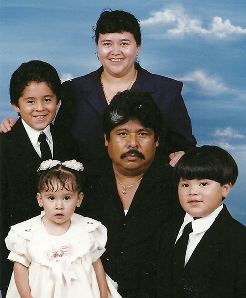 professional portrait of mariana's parents and two brothers when they were kids