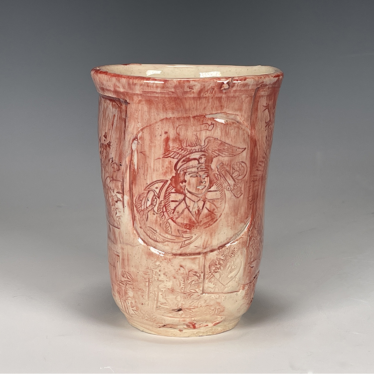 Gloria Kinder's pink military cup showing inscriptions of the first woman Marine media campaign image.