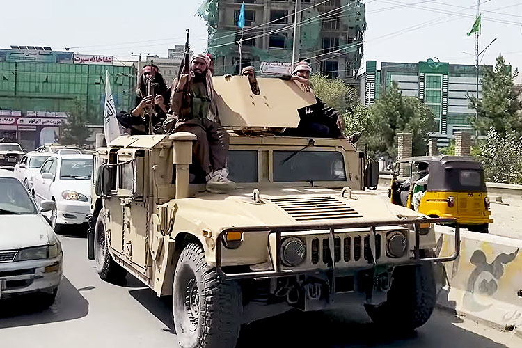 Armed Taliban militia patrolled in a Humvee in the days after they took over Kabul