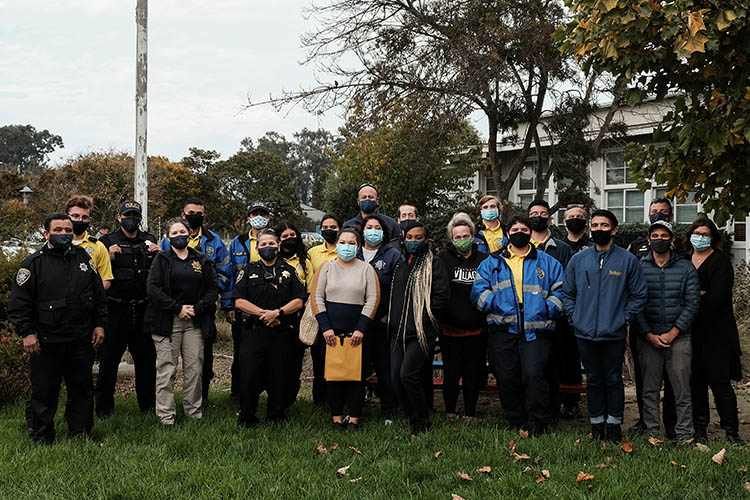 group of people stand outside for turkey giveaway