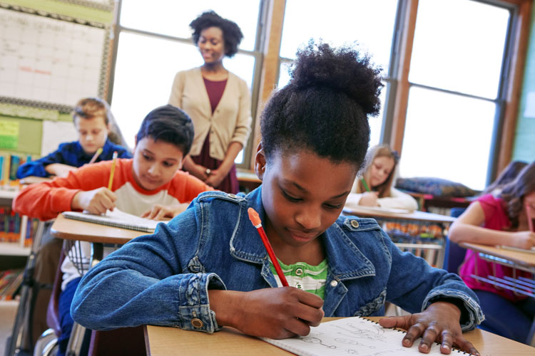 Schoolchildren working in a classroom.