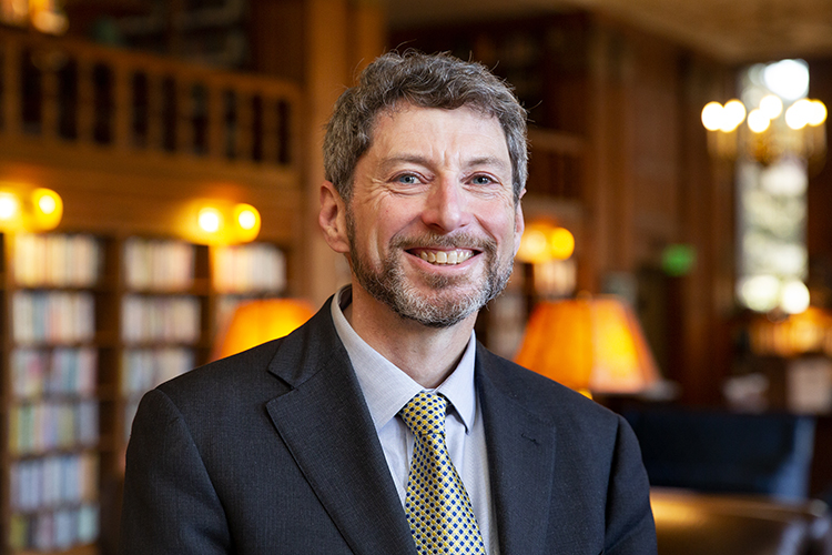 Ben Hermalin, Berkeley's new executive vice chancellor and provost, smiles in a close-up shot in the Morrison Library.