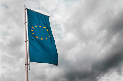 the EU flag in a cloudy sky
