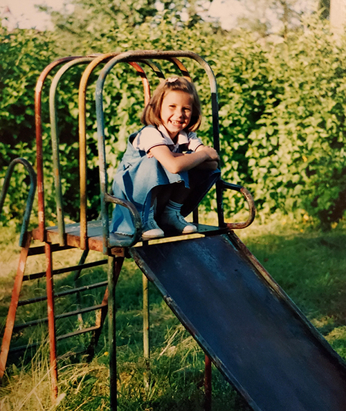 a child on top of a slide