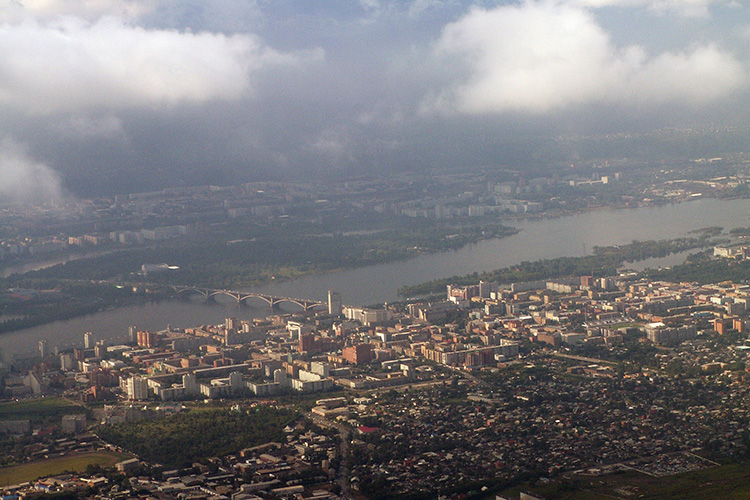 Aerial view of Krasnoyarsk, with dark smoke in the skies.